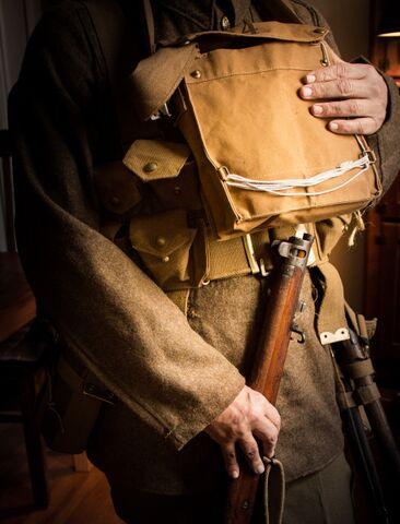 A bag containing a gas mask worn on the chest in what the Army called the ‘ready’ position.